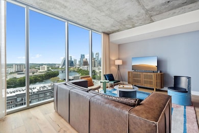 Living room featuring a wall of windows and light