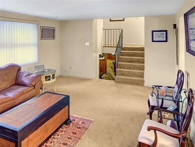 Living room and stairs to bedrooms.