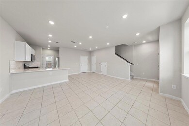 Unfurnished living room with recessed lighting, b
