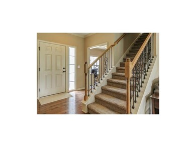 Welcoming entry with wood floors