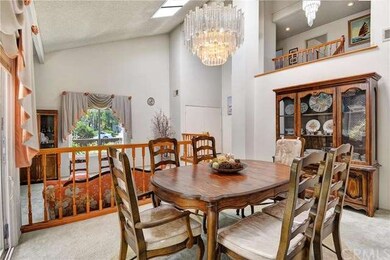 Separate dining area with a chandelier that is per