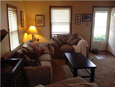 Living room with original woodwork and newer carpe