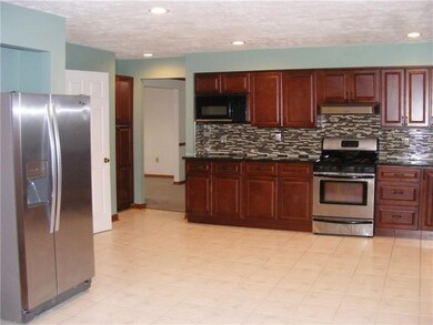 Large New Kitchen with Granite Countertops and Sta