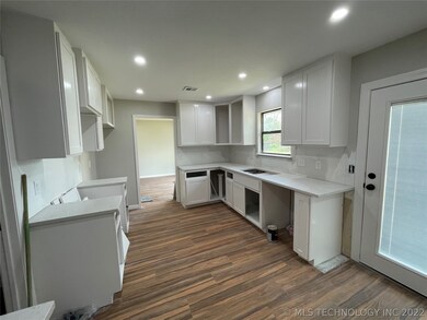 Kitchen in progress.  All new cabinets and quarts