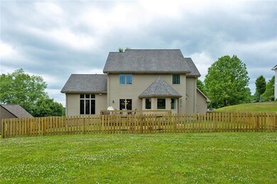 Rear view of 3327 Carriage Circle Drive with fence