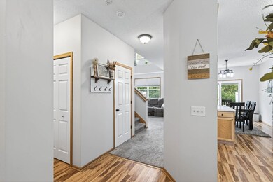 This entry greets you with convenience, located adjacent to the kitchen, 1/2 bath, mudroom and garage access all centered at the entrance of the home.
