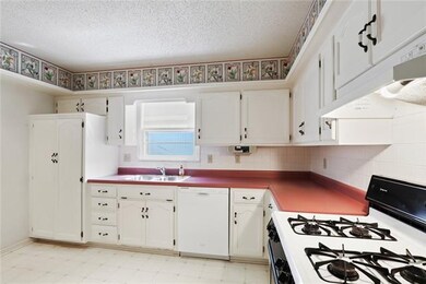 Open kitchen with built-in pantry