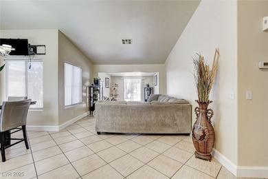 Living area with light tile patterned floors