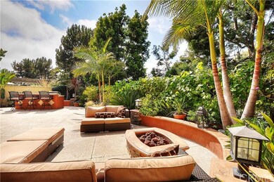 Inviting backyard with fire pit and large built in