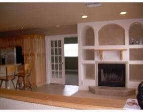 Living Room with Wood Burning Fireplace