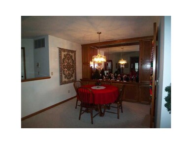 Dining Area. Dining room has a wall of mirrors sur