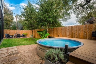 View of swimming pool featuring a wooden deck