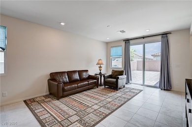 Living room featuring light tile patterned floors,