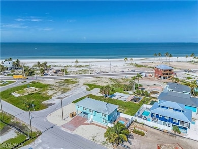 Bird's eye view with a beach view and a water view