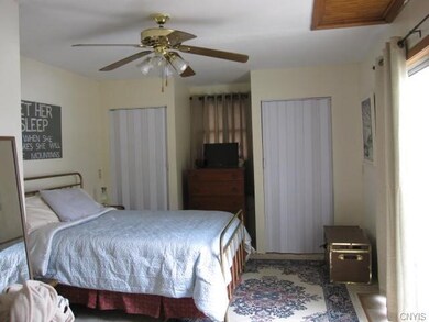 The upstairs bedroom encompasses the entire top fl