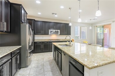 Kitchen featuring a sink, appliances with stainles