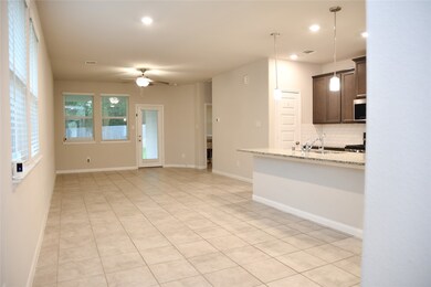 Open floorplan with dining, kitchen and living room in one space.