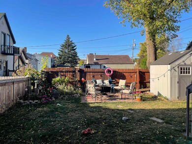 View of yard featuring a patio and a shed