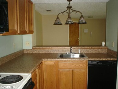 Kitchen - The kitchen overlooks the dining area an