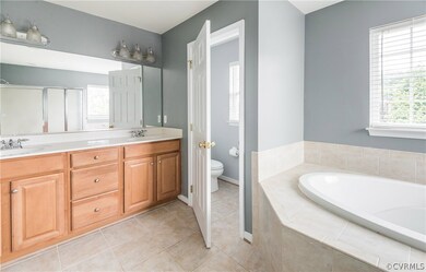 Master bathroom has ceramic tile floors and matchi