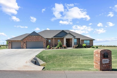 View of front of house featuring brick siding, dri