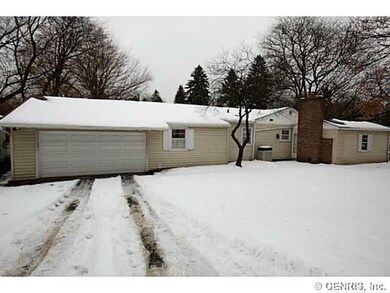 Exterior Front. Attached two-car garage is around 