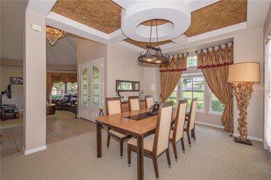 The formal dining room with with coffered ceilings