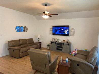Family Room with vaulted ceiling with new laminate