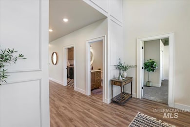 Hall featuring light wood-type flooring and recessed lighting