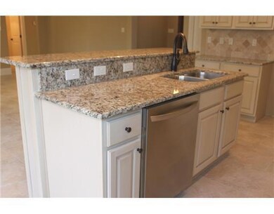 Kitchen. The kitchen island has an under mount sta