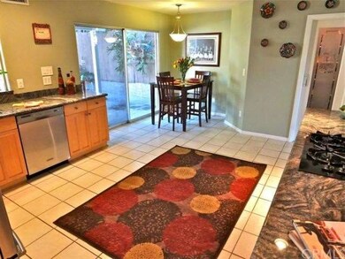 Kitchen with pantry on right and doors to patio