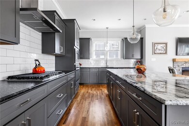 Kitchen featuring sink, hanging light fixtures, st