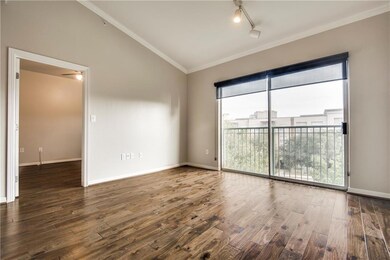 Gleaming hardwood floors in living, dining area an