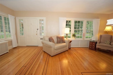 Living room has beautiful refinished hardwood floo