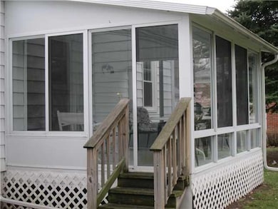 Exterior Back. This Three Season room offers the p