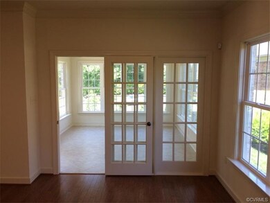 Sun room with french doors off the breakfast area