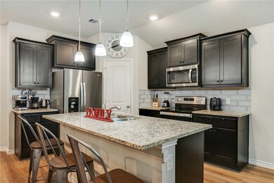 Kitchen featuring appliances with stainless steel