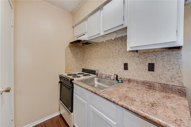 Kitchen featuring range with electric cooktop, lig