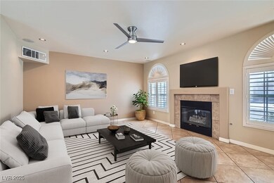 Tiled living room featuring plenty of natural ligh