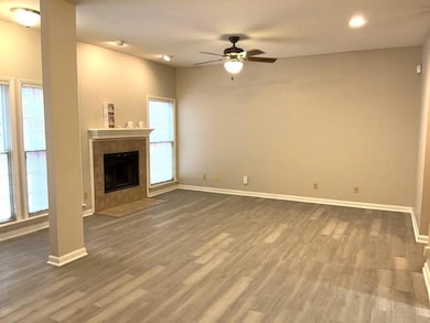 Unfurnished living room with baseboards, a ceilin