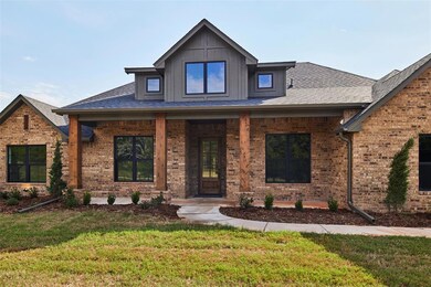 View of front facade featuring covered porch and a