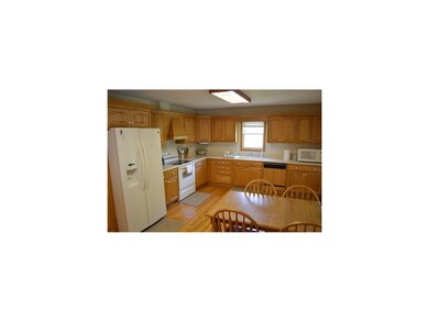 Kitchen. Work Island, Door to Screen Porch, Wood F