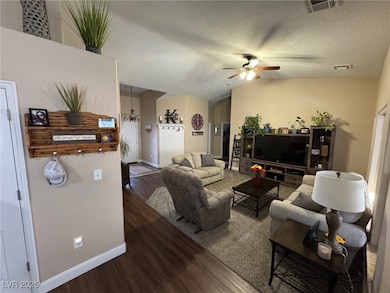 Living room featuring wood finished floors, a ceil