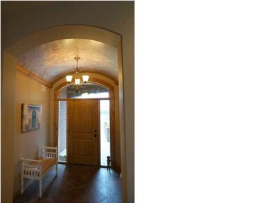 Barrel ceiling in foyer with indirect lighting