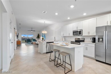 Kitchen featuring stainless steel appliances, pend