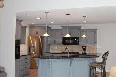 Island bar with granite counter tops.