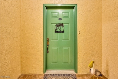 Entrance to property featuring stucco siding