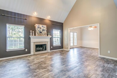 Wood-burning fireplace to create a cozy atmosphere in the living room.