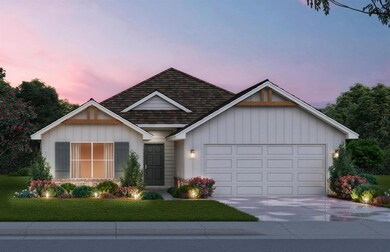 View of front of house with a garage and a yard