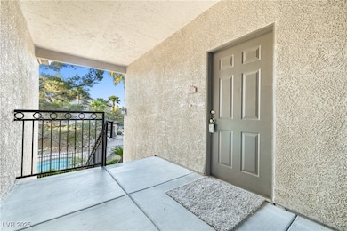 Property entrance featuring stucco siding